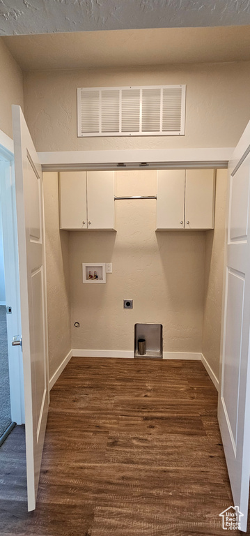 Washroom with electric dryer hookup, washer hookup, dark hardwood / wood-style floors, cabinets, and gas dryer hookup