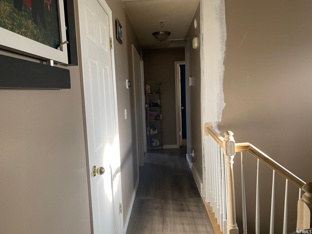 hallway with hardwood flooring