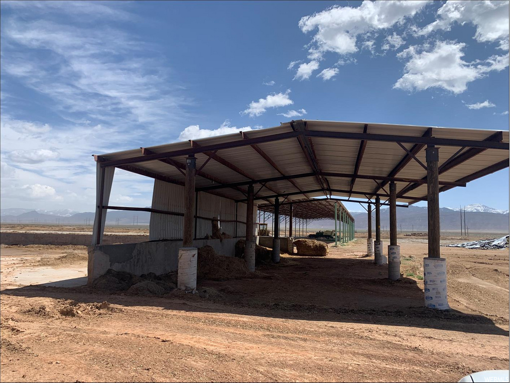 view of vehicle parking with a mountain view