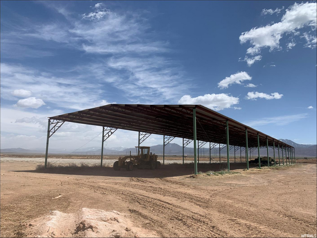 view of parking / parking lot featuring a mountain view