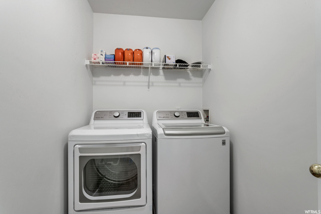 laundry room with separate washer and dryer