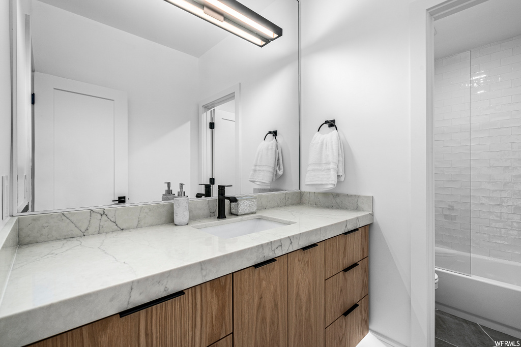 full bathroom featuring mirror, toilet, bathtub / shower combination, and vanity