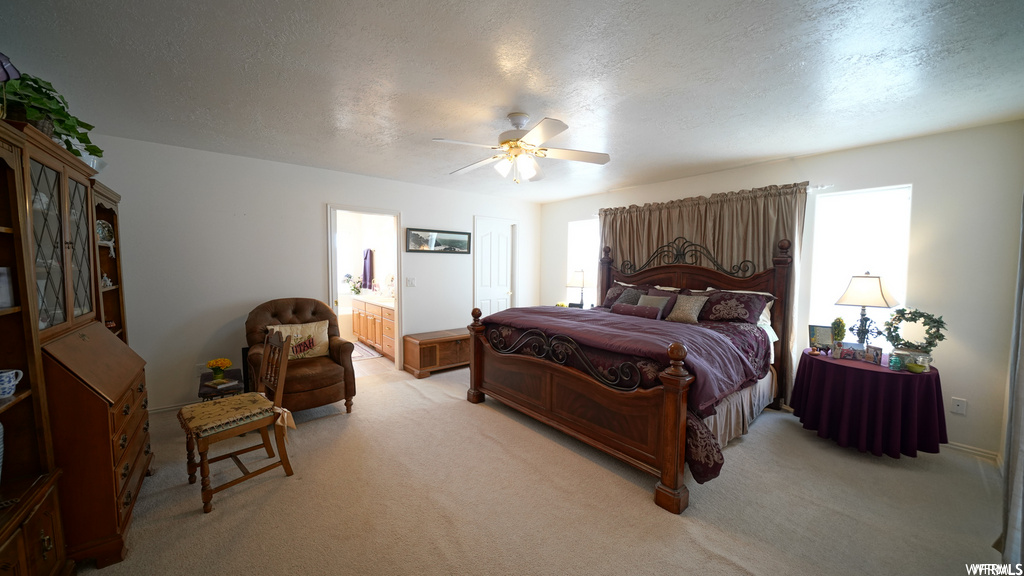 carpeted bedroom featuring a ceiling fan