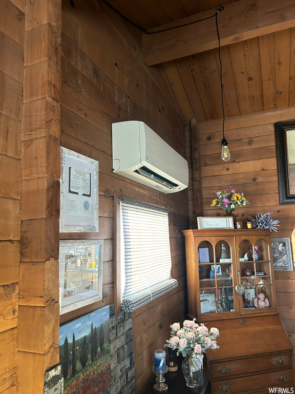 interior space with natural light and a wall mounted air conditioner