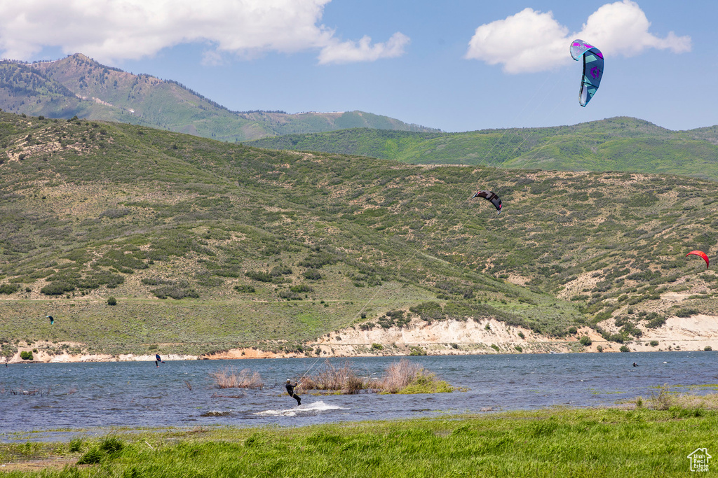 View of mountain backdrop featuring a large body of water
