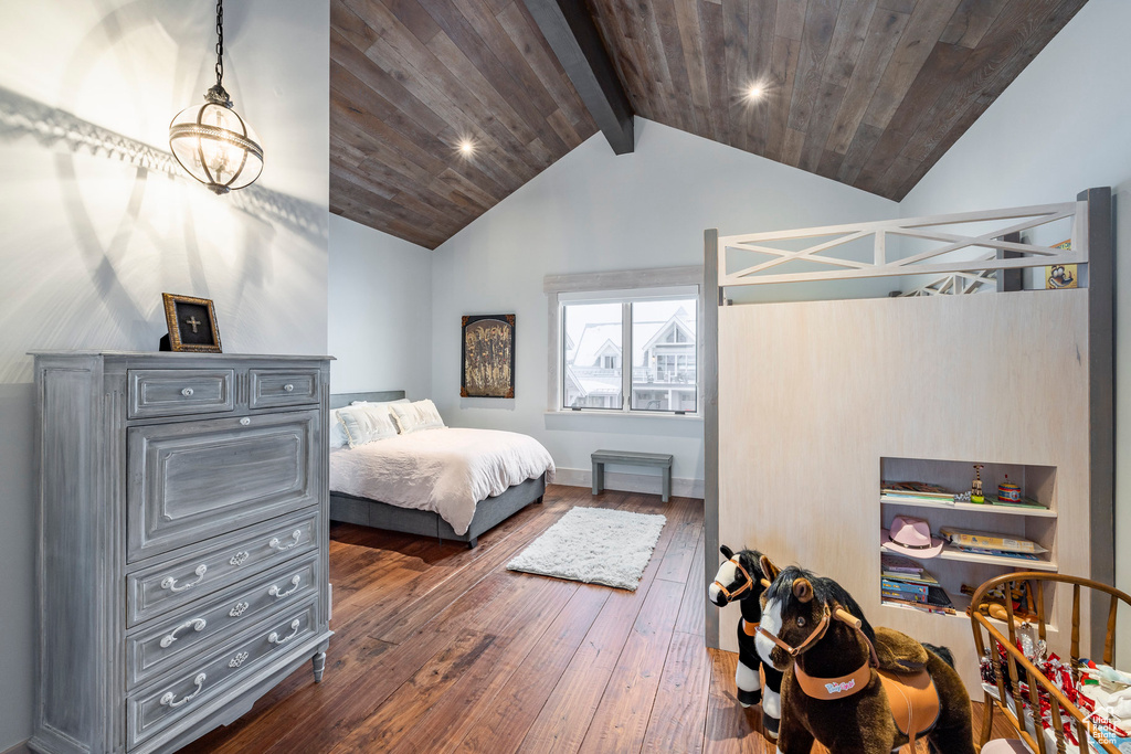 Bedroom with dark wood-type flooring, baseboards, and recessed lighting