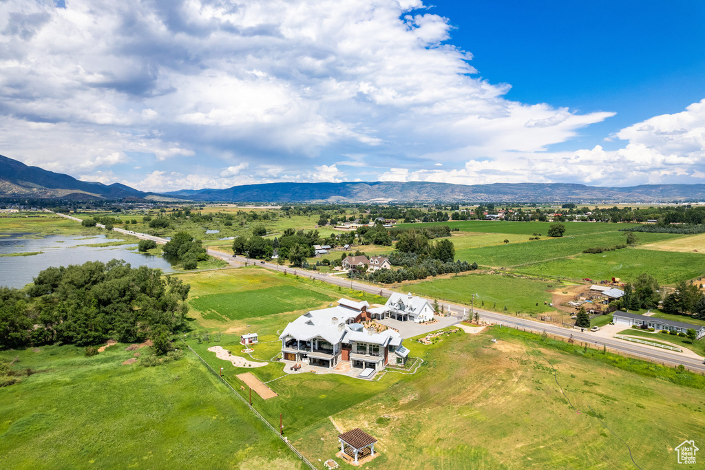 Aerial view of sparsely populated area featuring a water and mountain view