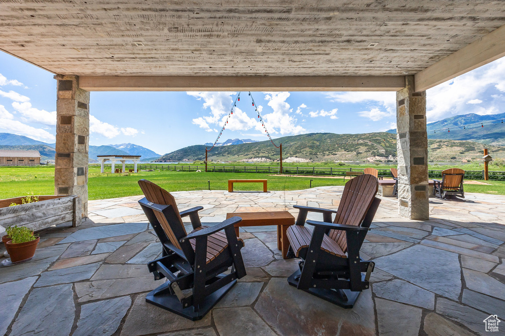 View of patio / terrace with a mountain view