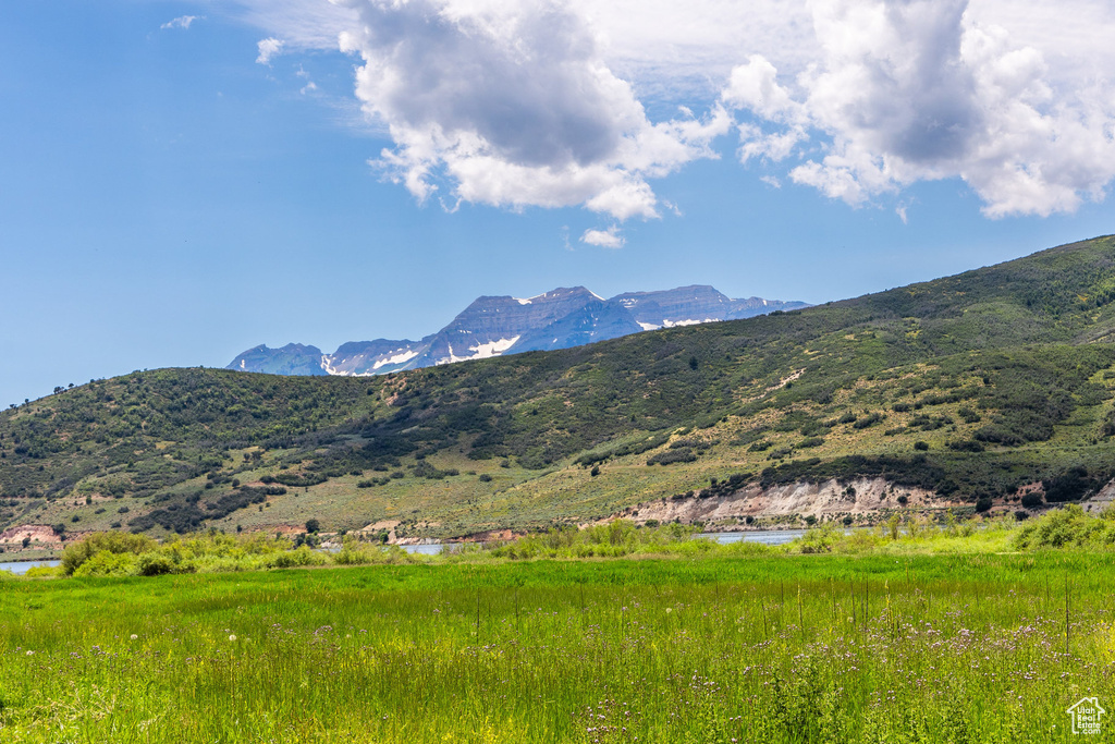View of mountain backdrop with a large body of water
