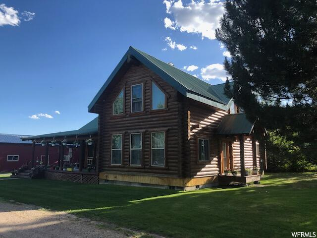 view of side of property featuring a yard