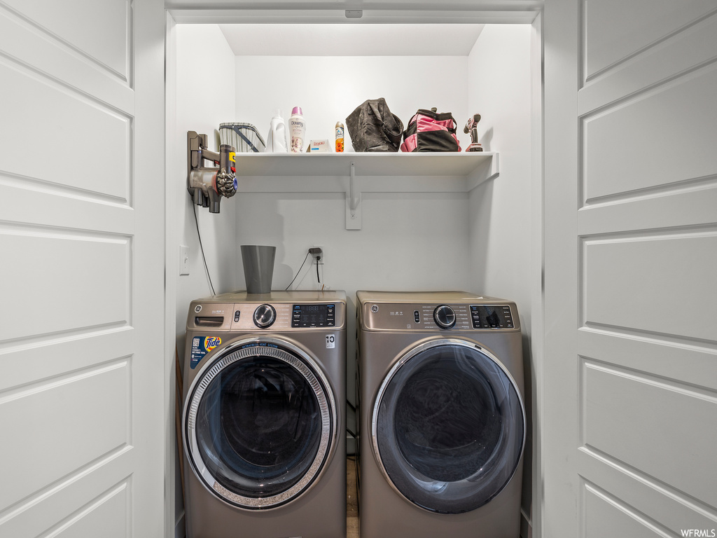 laundry room featuring separate washer and dryer