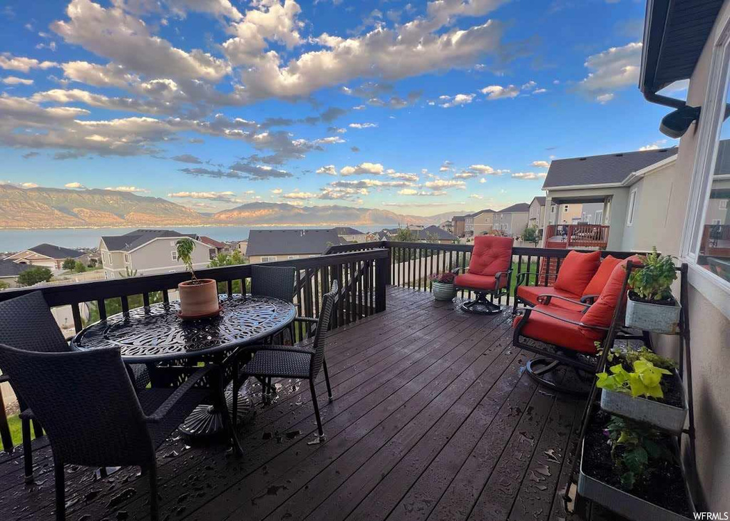 Wooden terrace featuring a mountain view