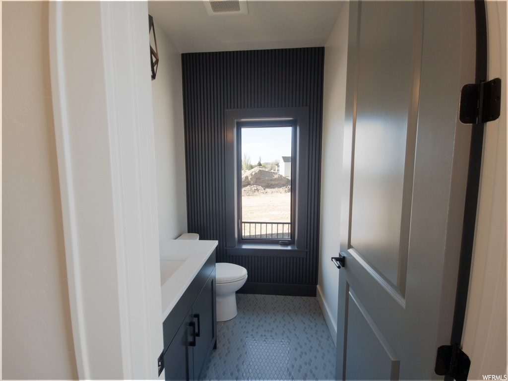 Bathroom with tile floors and vanity