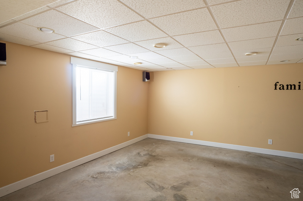 Empty room featuring a paneled ceiling
