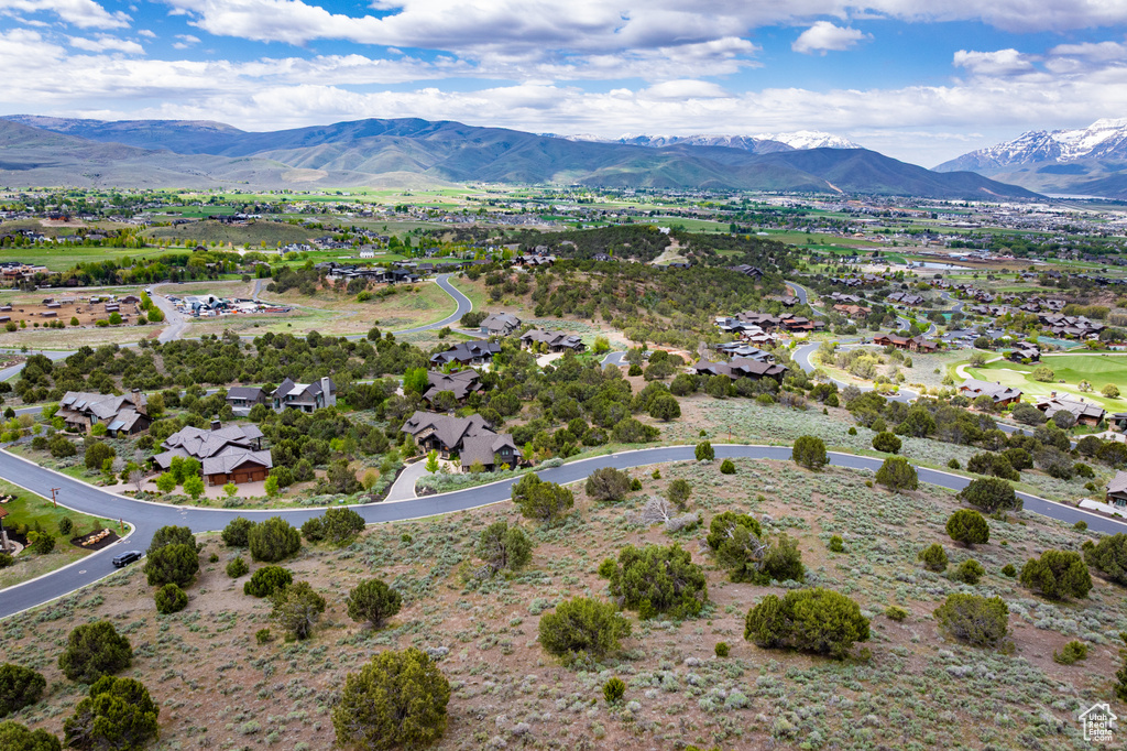 Aerial perspective of suburban area featuring a mountain backdrop