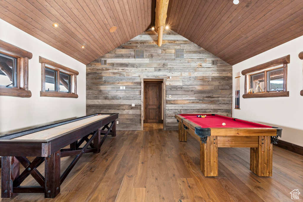 Game room featuring billiards, wood walls, lofted ceiling with beams, wooden ceiling, and dark hardwood / wood-style flooring