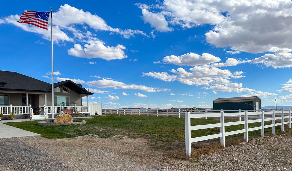 View of yard featuring covered porch