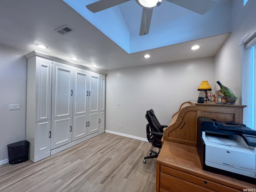 Office with hardwood flooring
