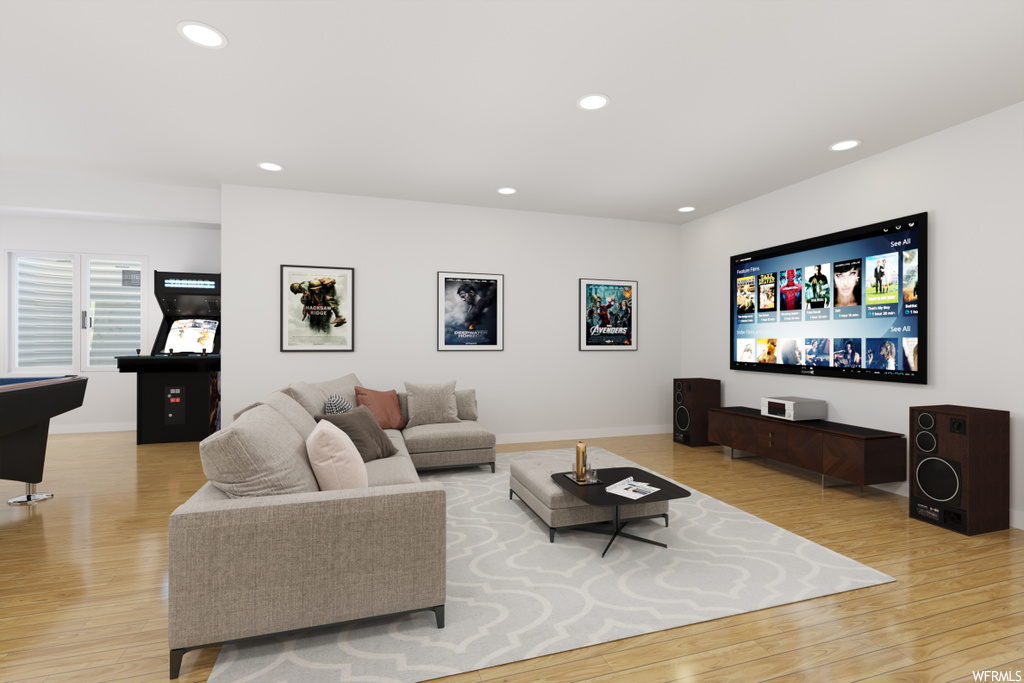 Hardwood floored living room featuring TV