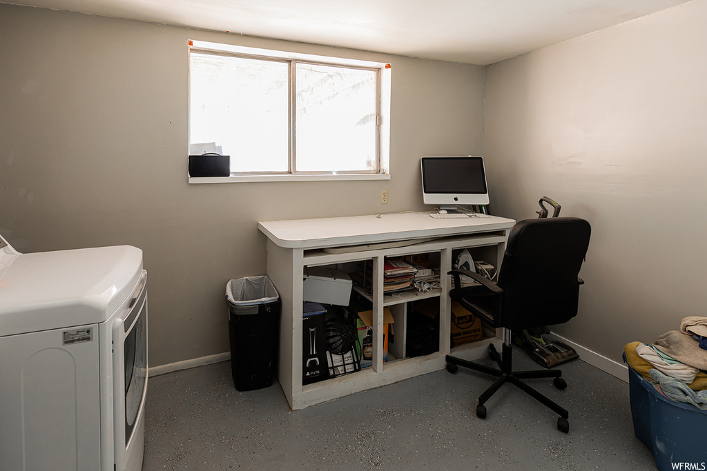 Office space featuring natural light, TV, and washer / dryer