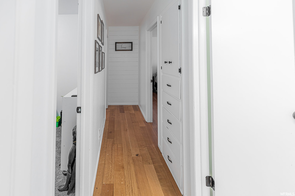 Corridor with hardwood flooring