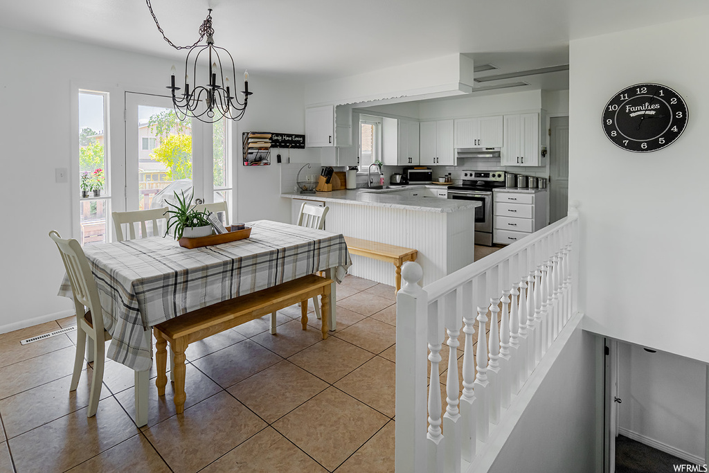 Dining space with tile floors and natural light