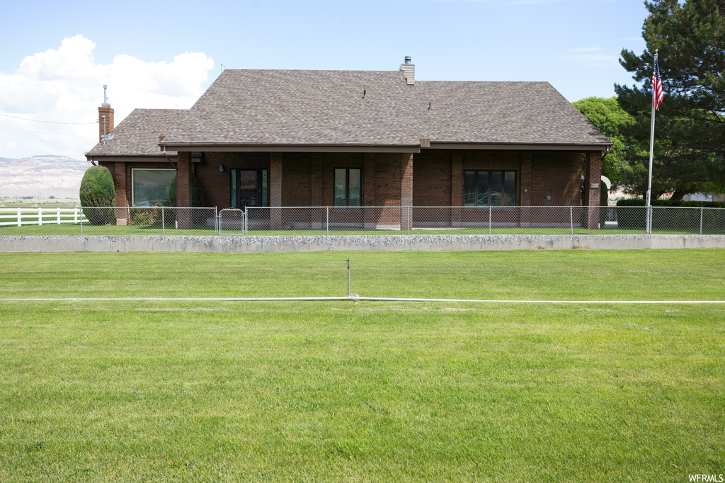 Exterior space with a front lawn