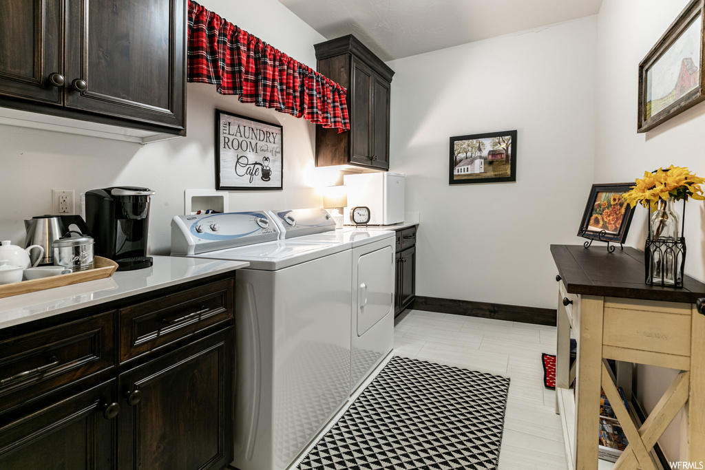 Laundry area featuring tile flooring and independent washer and dryer