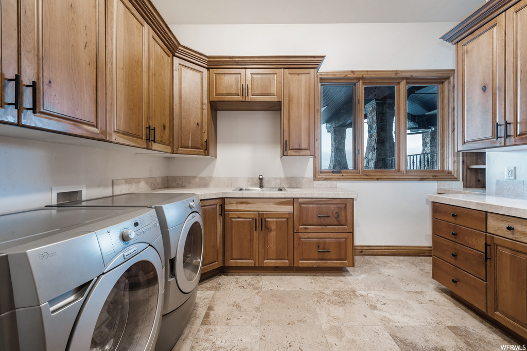 Laundry room featuring natural light and washer / dryer