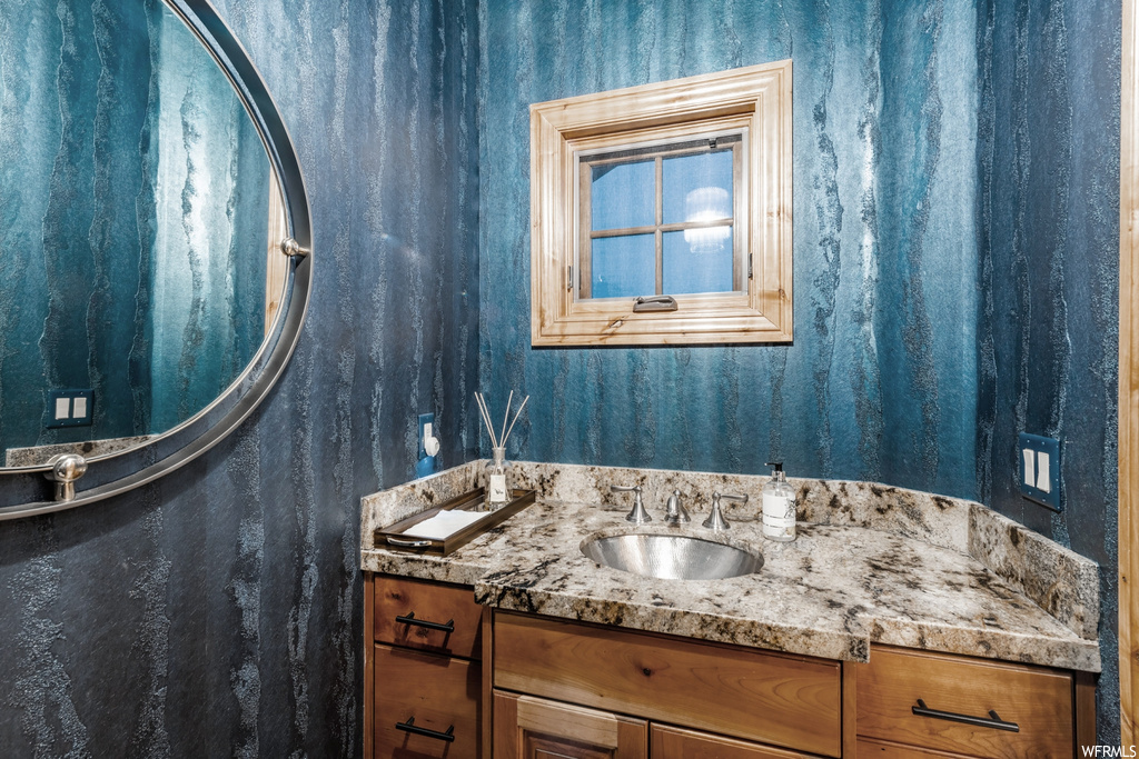 Bathroom with mirror and large vanity