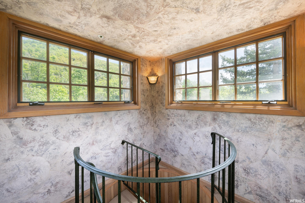 Staircase featuring natural light