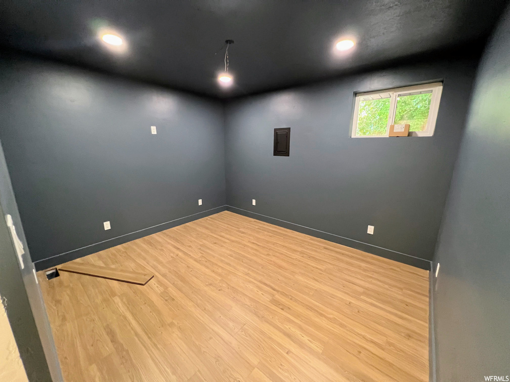Empty room featuring hardwood flooring