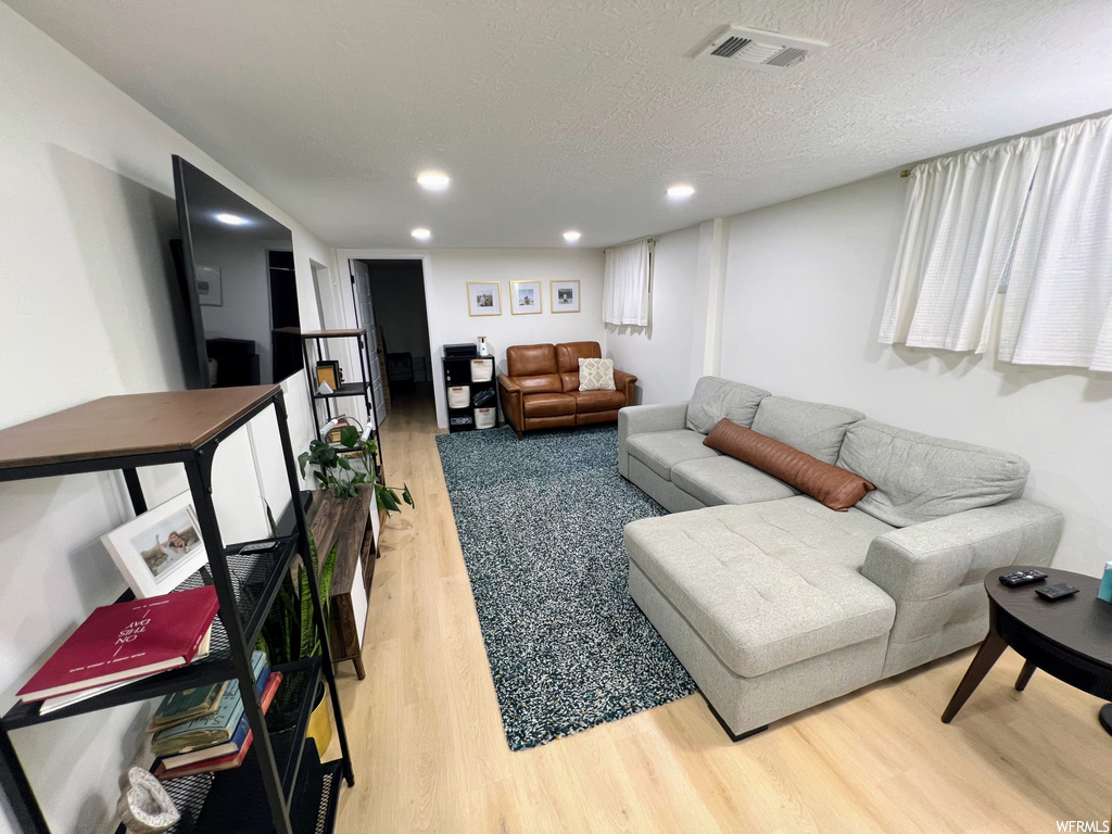 Living room featuring hardwood flooring