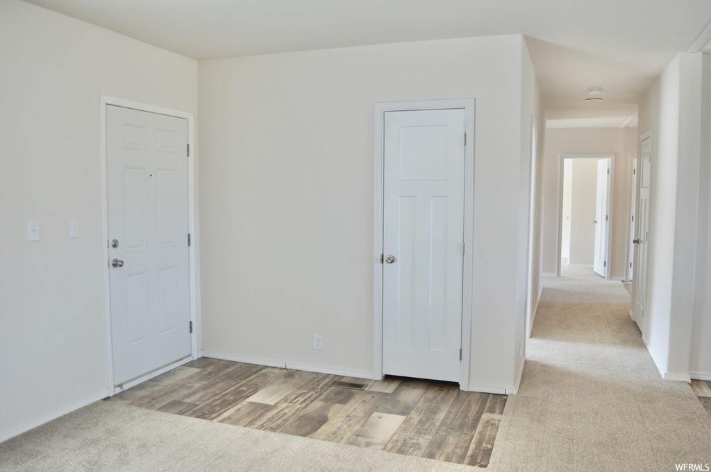Spare room with light hardwood flooring