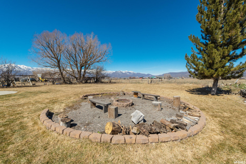 Yard featuring fire pit and a mountain view