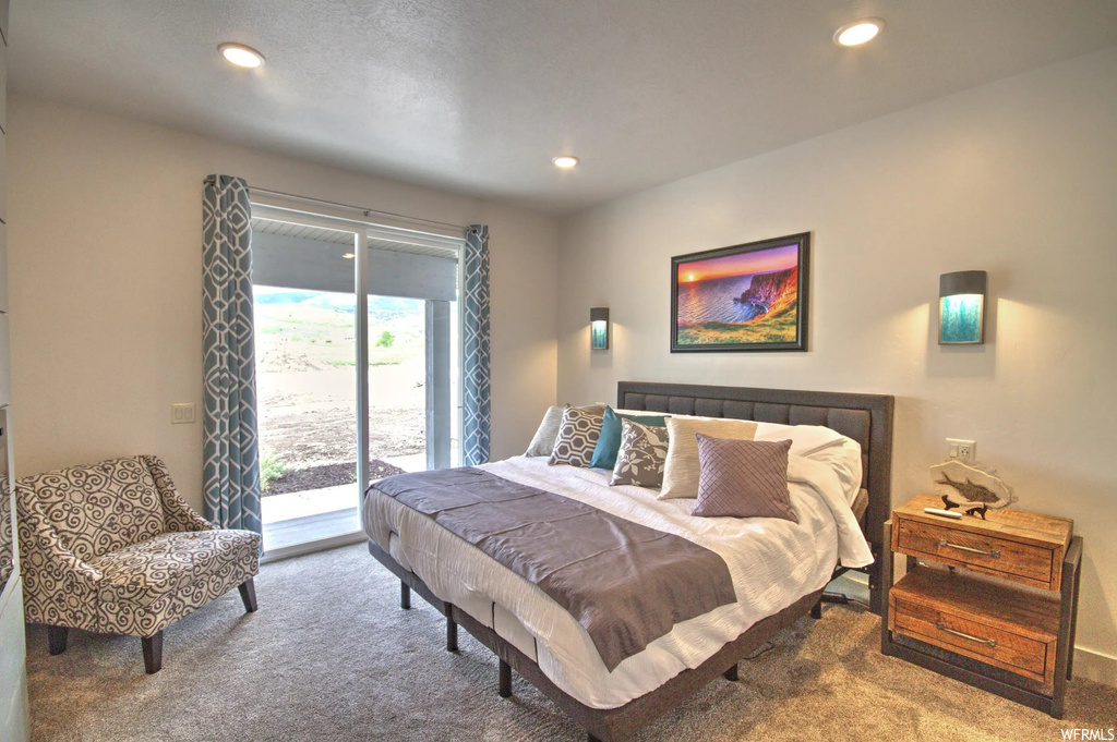 Carpeted bedroom with natural light