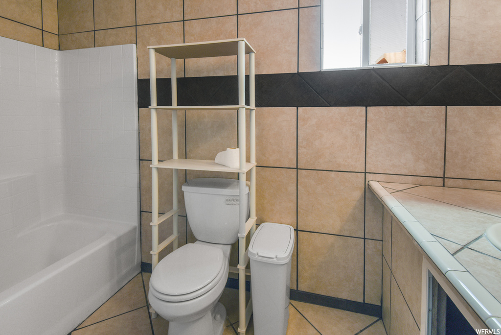 Full bathroom featuring tile flooring, shower / bathtub combination, vanity, and toilet