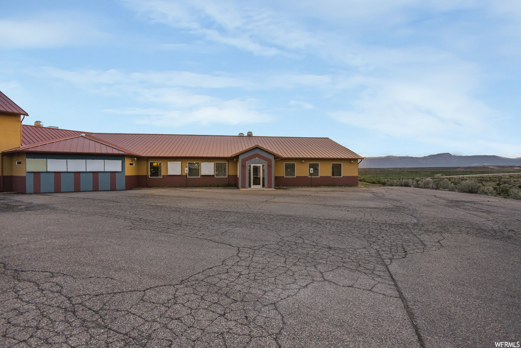 Single story home featuring a mountain view