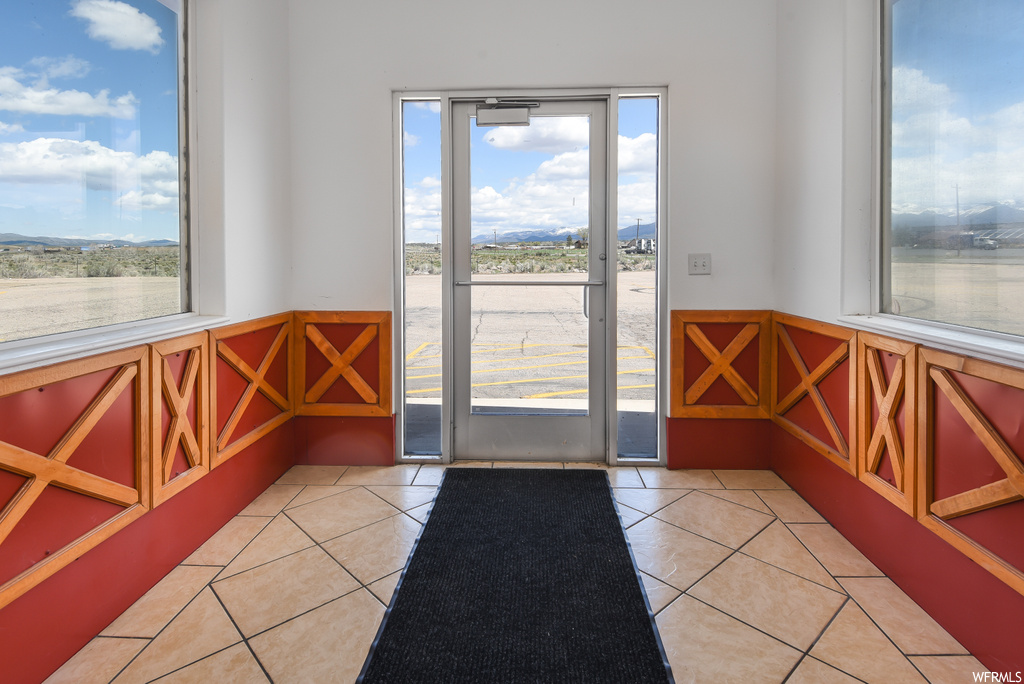 Entryway with tile floors and a wealth of natural light