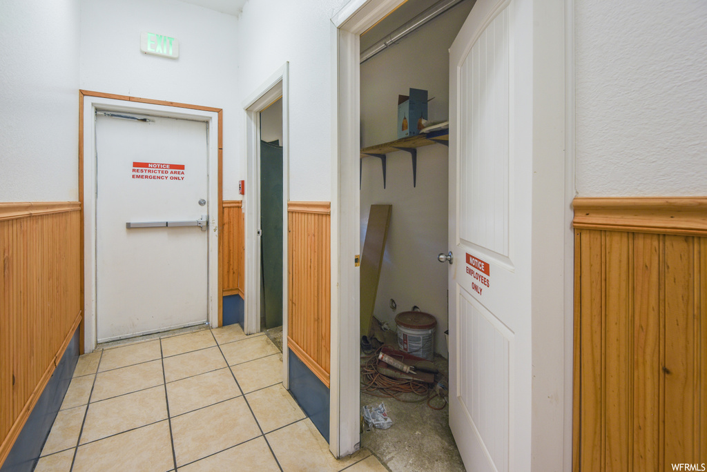 Corridor with tile flooring