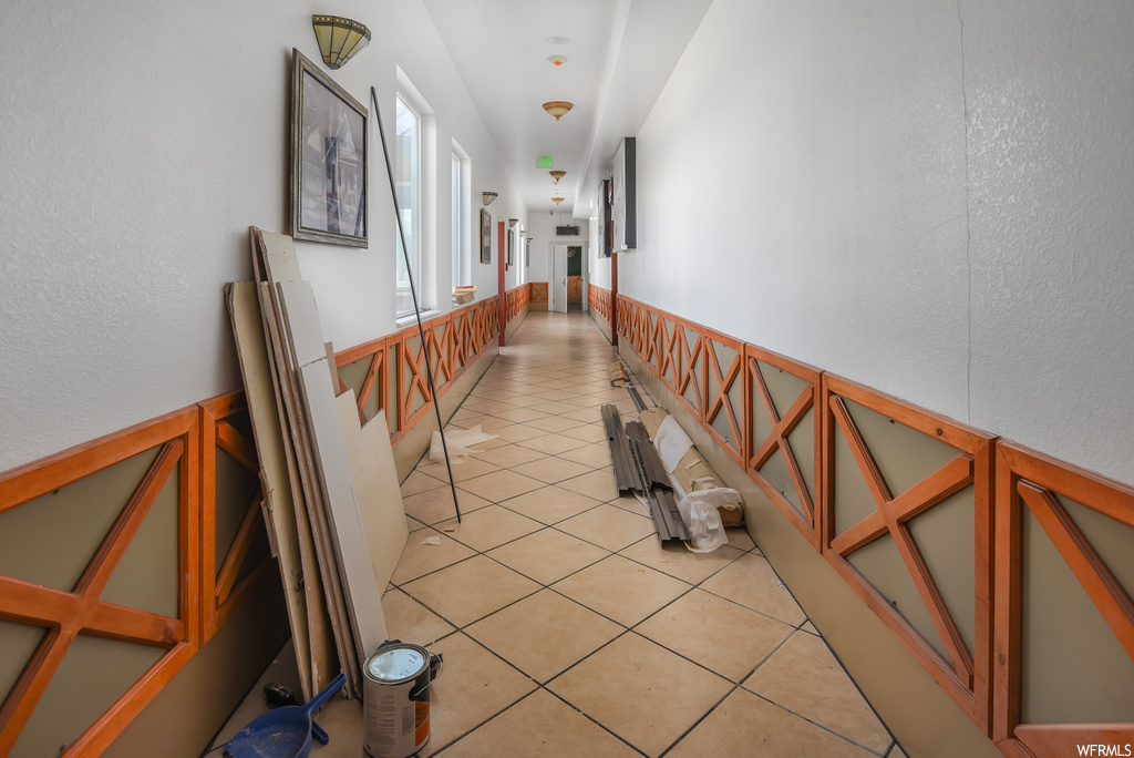 Corridor with tile flooring
