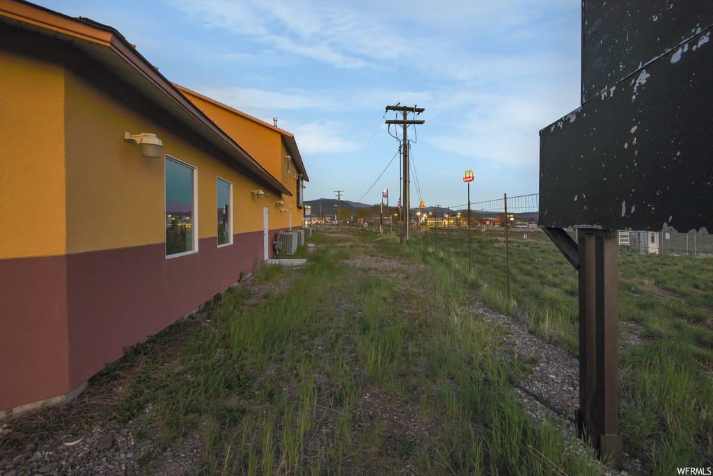 View of home's exterior with central AC