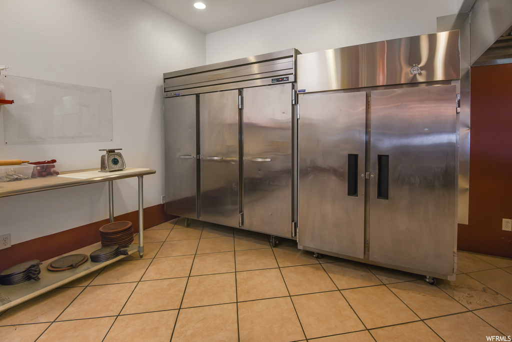Kitchen with light tile floors