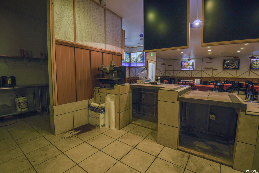 Kitchen with brown cabinetry and light flooring
