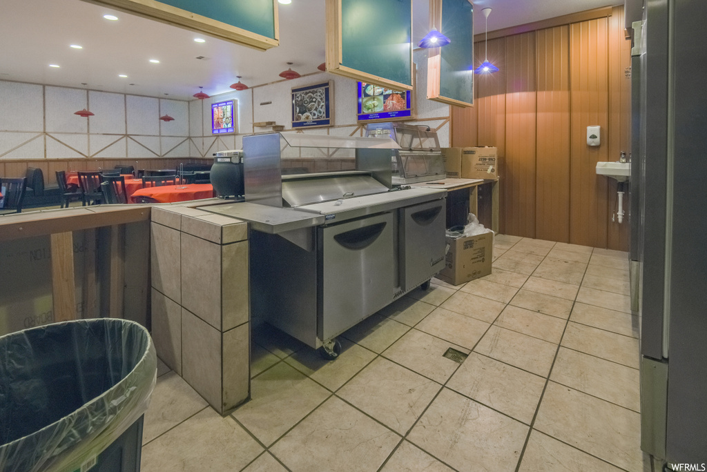 Kitchen with light countertops and light flooring