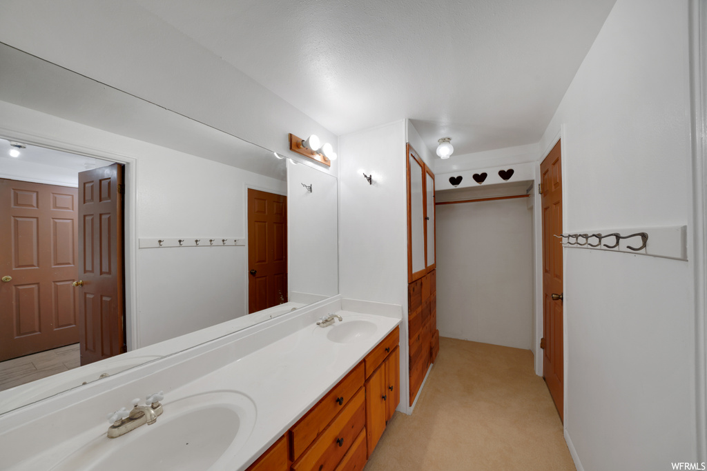 Bathroom with double vanity and multiple mirrors
