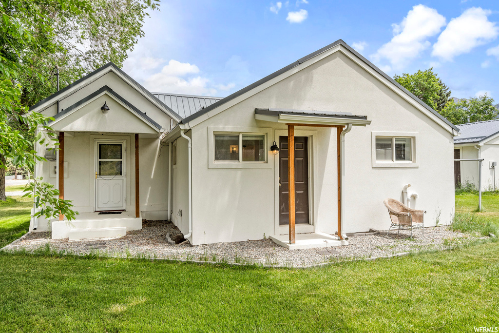 Exterior space with a yard