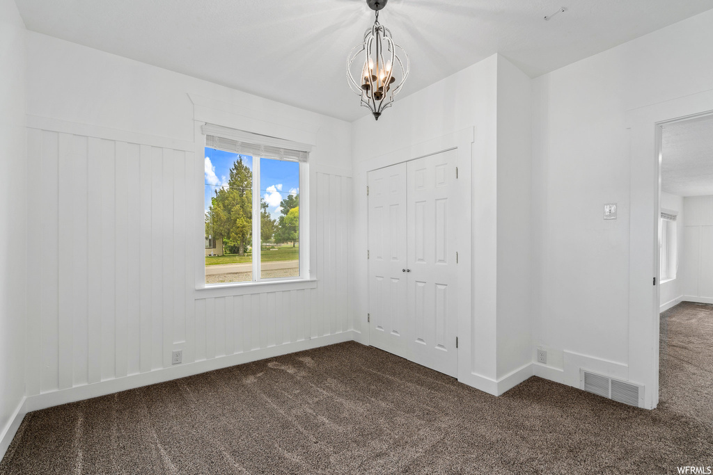 Bedroom with carpet and natural light