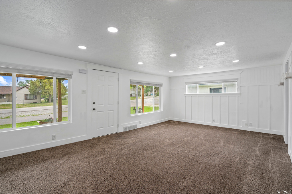 Spare room with carpet and natural light