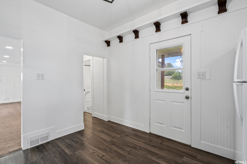Doorway with hardwood flooring